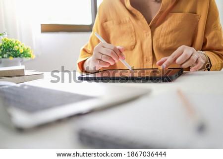 Young female designer artist drawing graphic for new design on tablet at home Art Design Drawing Business and creativity Website development concept