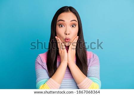 Close-up portrait of pretty amazed cheery girl incredible news pout lips isolated over bright blue color background