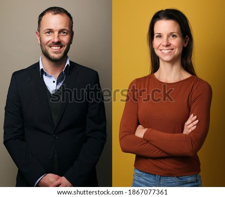 Two people in front of a colored background