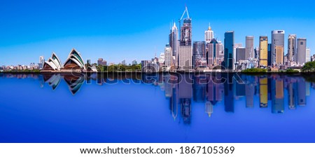 Sydney CBD skyline with reflection of buildings in the harbour waters 