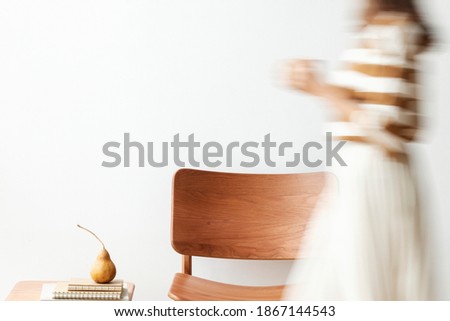 Blurred woman holding a coffee cup