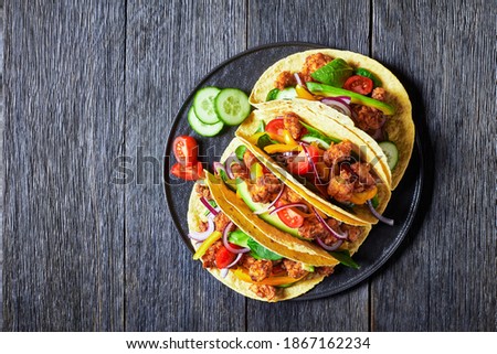 chicken street corn tacos with veggies and salsa Royalty-Free Stock Photo #1867162234