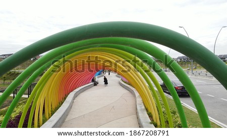A beautiful bridge made of rainbow colours arches. Selective focus and blurred background