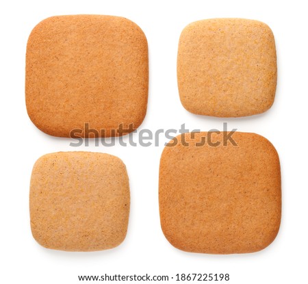Gingerbread cookies in shape of squares in various size isolated on white background. Top view Royalty-Free Stock Photo #1867225198
