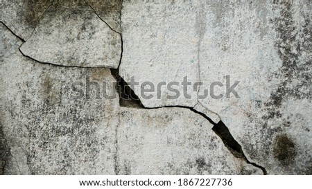 The cracked on the old wall, photographed in close range with natural light. Great for background and wallpaper.