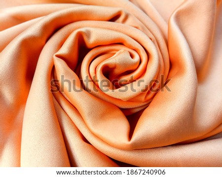 Gold color texture of satin Fabric. Rose pattern and elegance of satin Fabric background.