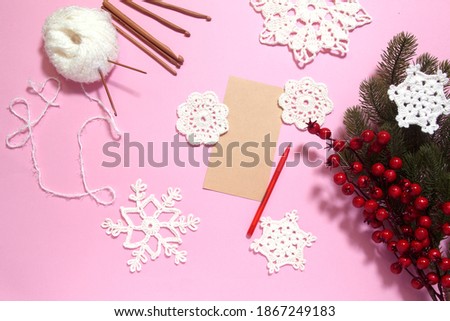 Making of handmade Chrisrmas greeting card with crochet openwork snowflakes. Making of handmade decoration. New year crafts. Childrens DIY, hobby concept, gift with your own hands.