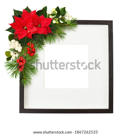 Dark brown wooden square frame with corner Christmas floral arrangement isolated on white background. Mock-up.