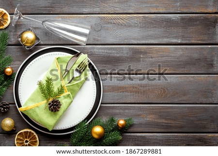 Christmas dinner concept with empty plate and glasses. Top view, flat lay