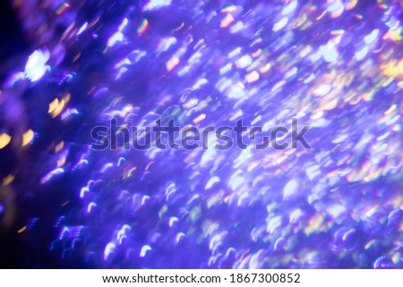 Easy to add lens flare effects for overlay designs or screen blending mode to make high-quality images. Abstract sun burst, digital flare, iridescent glare over black background. Defocused bokeh.
