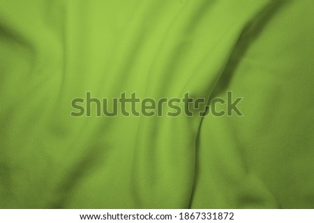 Abstract rippled green clothe mesh background.