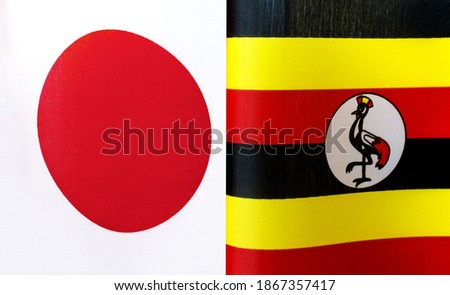 fragments of the national flags of Japan and Uganda close-up