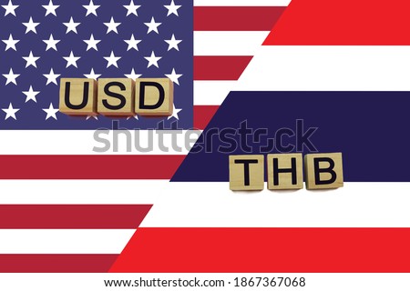 USA and Thailand currencies codes on national flags background. USD and THB currencies Royalty-Free Stock Photo #1867367068
