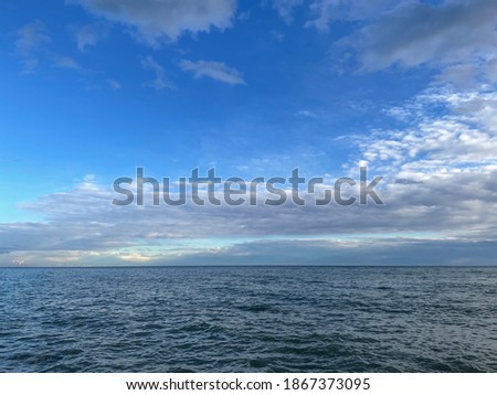 Sky and sea of ​​the Mediterranean coast on a slightly cloudy day Royalty-Free Stock Photo #1867373095