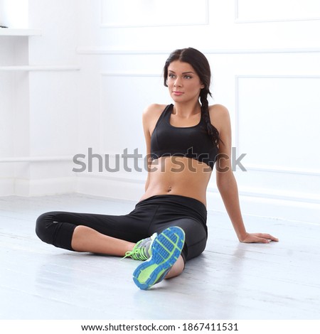 Cute, attractive woman on the floor