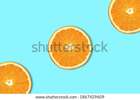 The Orange slices isolated on the blue background