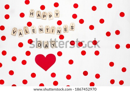 Valentines red shape of heart and text with wooden letters on white background. Greeting card, banner