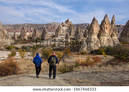 Dad and son walk through the fabulous landscapes of Cappadocia. Turkey