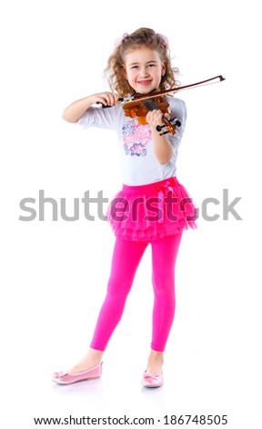 Little cute girl playing the violin isolated on white.