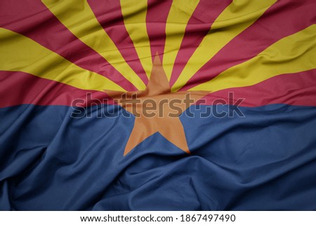 waving colorful flag of arizona state. macro shot Royalty-Free Stock Photo #1867497490