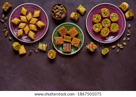 Traditional turkish, arabic sweets baklava assortment with pistachio. Top view, copy space                        