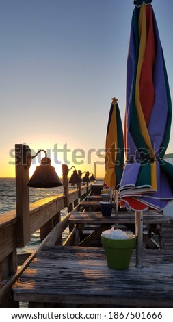 Colorful umbrellas on seaside patio deck