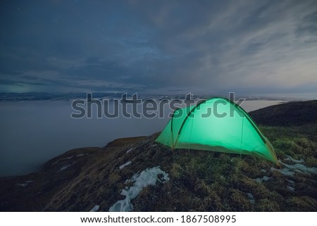 Camping at an altitude of 3200 m. Against the background of Elbrus.