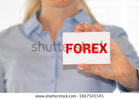 FOREX word on business card shown by a man, vintage tone.