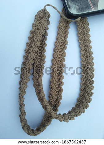 handcrafted brown knit cell phone hanger, strong, elegant and durable