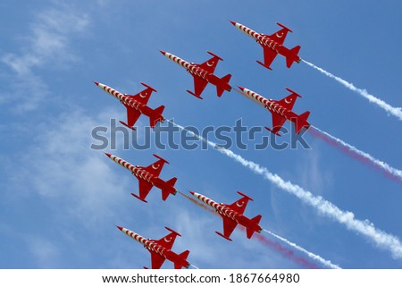 The Turkish Stars are the aerobatic demonstration team of the Turkish Air Force and the national aerobatics team of Turkey.  Royalty-Free Stock Photo #1867664980