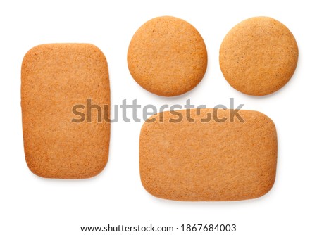 Gingerbread cookies in shape of rectangles and circles isolated on white background. Top view Royalty-Free Stock Photo #1867684003