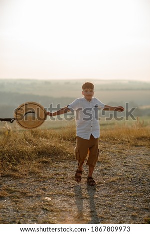 Portrait of a boy with straw hat