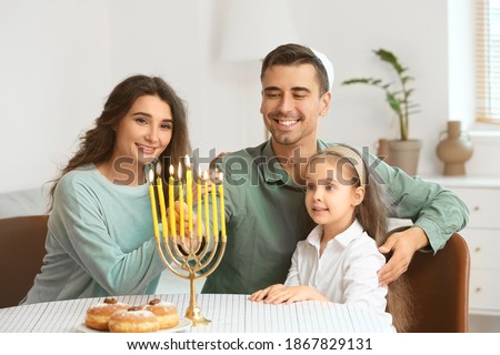 Happy family celebrating Hannukah at home