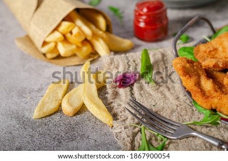 Delicious tender chicken chnitzel with homemade french-fries