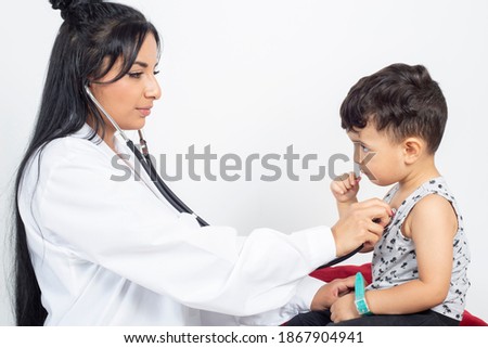 female doctor auscultating a child, on white background