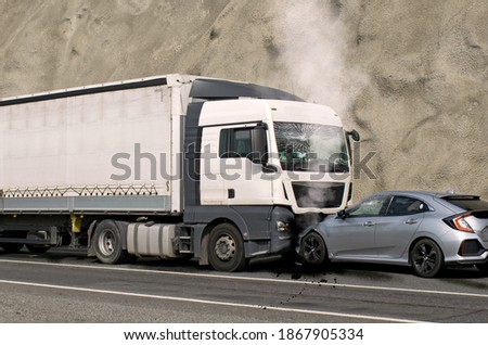 Accident between a truck and a car. Speed and carelessness on the street.  Royalty-Free Stock Photo #1867905334