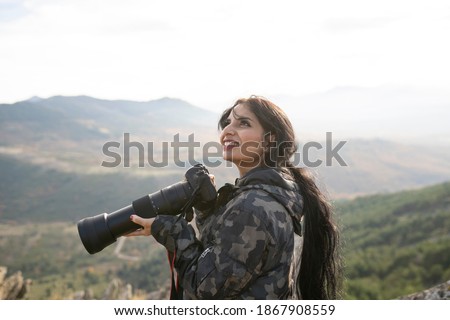 pretty woman with photo camera, nature photography