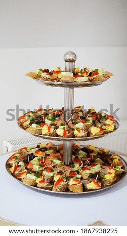 Catering meal pieces of bread with  meat and vegetable ready to eat on tray