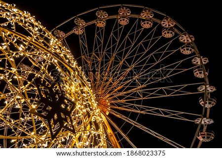 A beautiful Ferris wheel now at Christmas time. The picture was taken in the evening to bring out the beautiful lights.