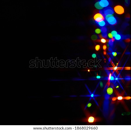 Holiday blurred bokeh background, glitter stars, light effect, party. Blurred color light abstract background with bokeh defocused lights