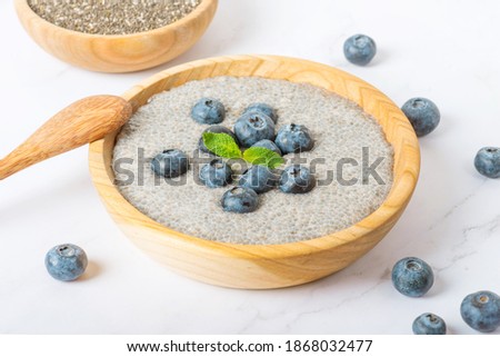 Chia pudding with blueberries. chia pudding with blueberries in a coconut bowl