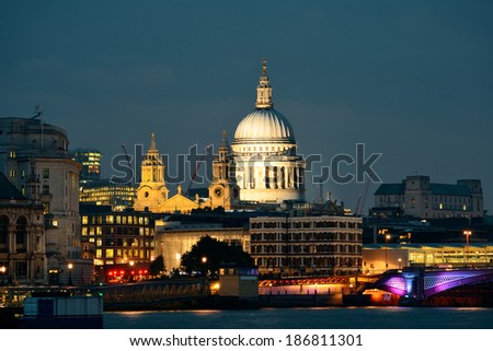 St Pauls Cathedral over Thames River at night in London.