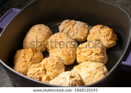 Closeup of fresh biscuits in a Dutch oven. High quality photo taken at the peak of freshness