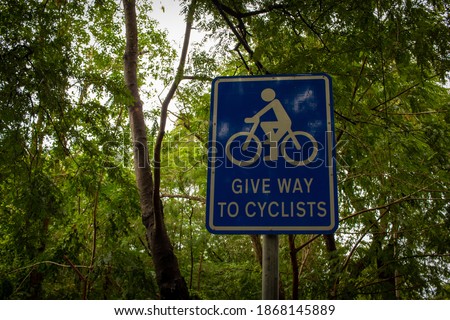 View of Give way sign to cyclists board. Alerting road users to give way or yield for cyclists