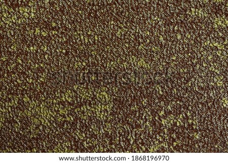 yellow gold color on a rough surface texture background. Image photo