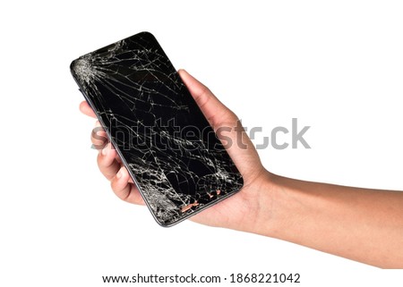 Broken smartphone in hand isolated on white background with clipping path


