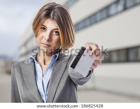 beautiful young business woman using a credit card