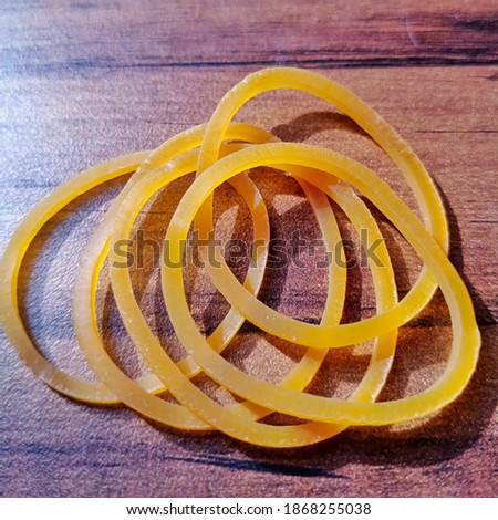 Rubber bands,  are made from processing latex, natural rubber , so that they are yellow in color. it is elastic and flexible, can be used to tie many things and can be used for children's toys. 