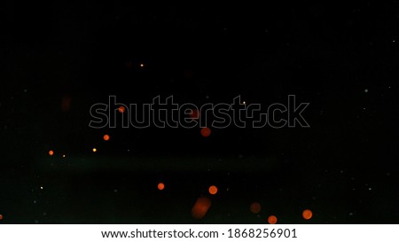 Fire flames with sparks isolated on a black background.