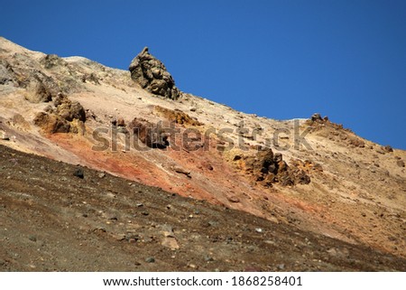 Mutnovsky volcano. Sharp rocks against the blue sky on a slope of a crater of the active volcano. Archive photo, 2008